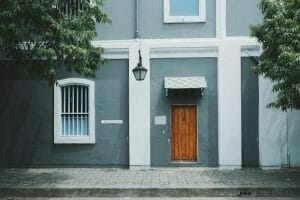 Image of a Blue Building and Brown Door for Real Wealth Show Podcast Episode #680