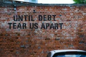 Picture of "Until Debt Tear Us Apart" Graffiti for Real Wealth Show Podcast Episode #692